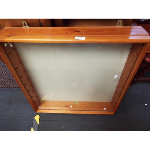 622 - A pine and glass hanging display case with glass shelves