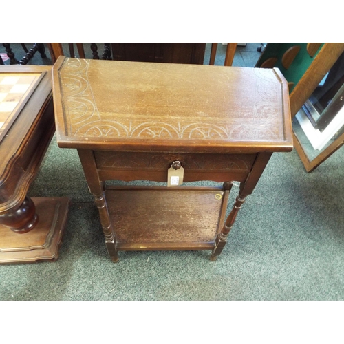 629 - A carved oak hall table with frieze drawer