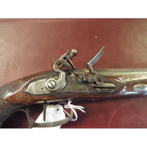 117 - A London made late 18thC flintlock pistol the barrel having hammered decoration and four gold cut ca... 