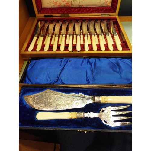 87 - A canteen of bone handle silver plated ornate fish cutlery (twelve settings) and a fish server and f... 