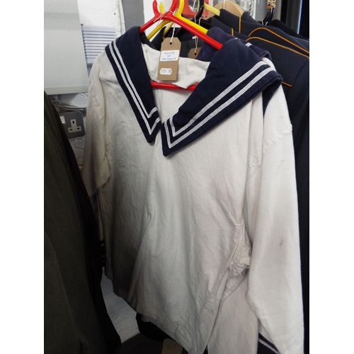 447 - A pair of Royal Navy tunics size 28