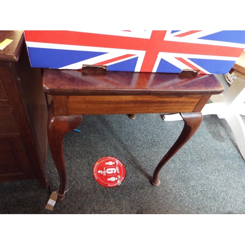 461 - A mahogany side table resting on cabriole legs