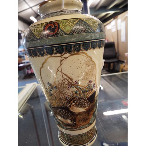 12 - A hand-painted Satsuma vase with bird pictorial panels signed to base