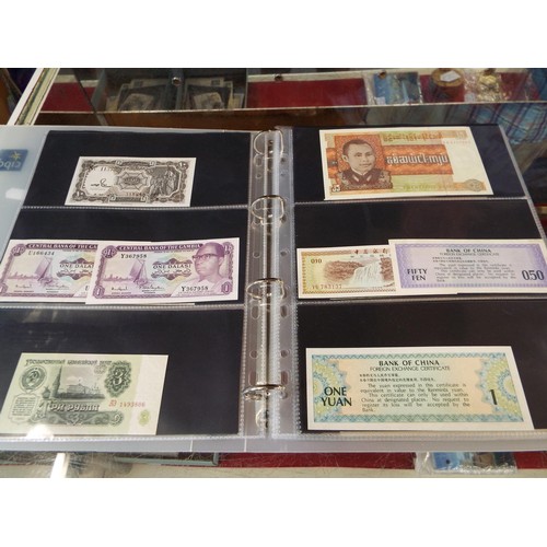 101 - An album housing approx seventy one foreign bank notes to include 'Republica Argentina', 'Banque Du ... 