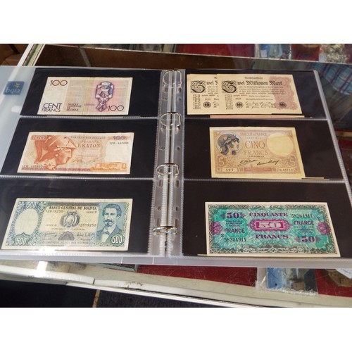 101 - An album housing approx seventy one foreign bank notes to include 'Republica Argentina', 'Banque Du ... 