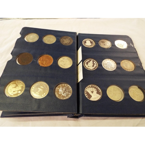 106 - A coin library album containing forty five crowns and coins to include Dollars, E. Caribbean, Jamaic... 