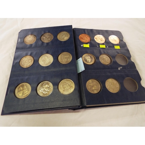 107 - A coin library album containing nineteen Asian crowns and coins
