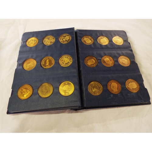 109 - A coin library album containing forty four assorted crowns and coins to include Ceylon, Mauritius, A... 