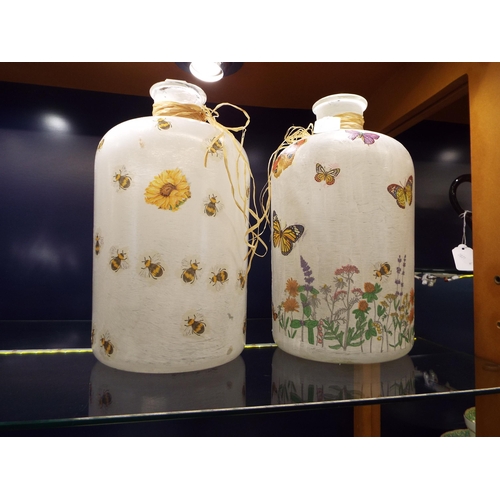 23 - Two hand-painted glass jars with butterfly and bumble bee decoration