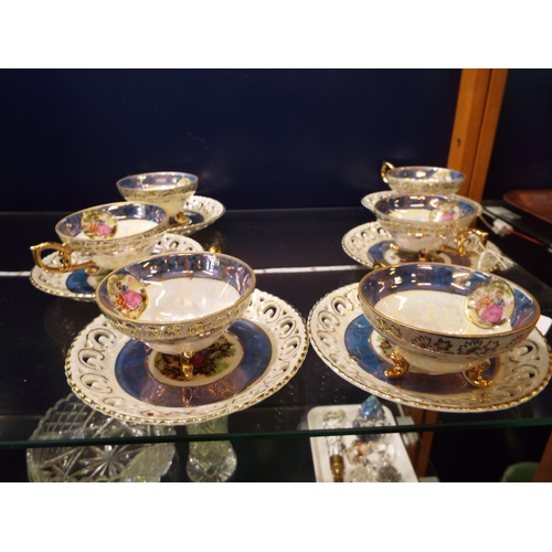 33 - A continental lustre tea-set with pictorial panel decoration