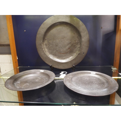 62 - A large early pewter plate together with two other pewter plates (London marks)