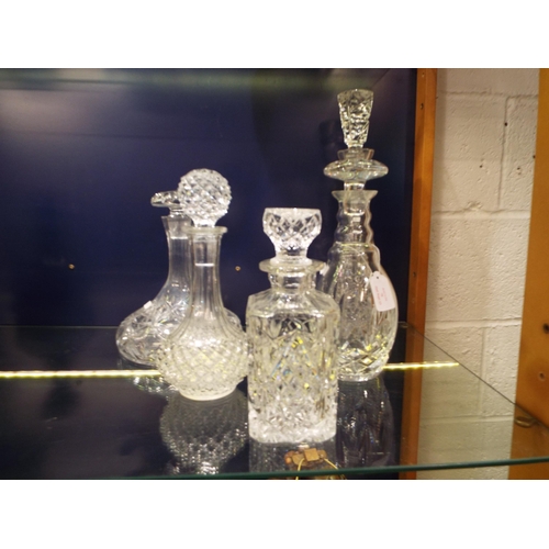 70 - Five assorted crystal glass decanters