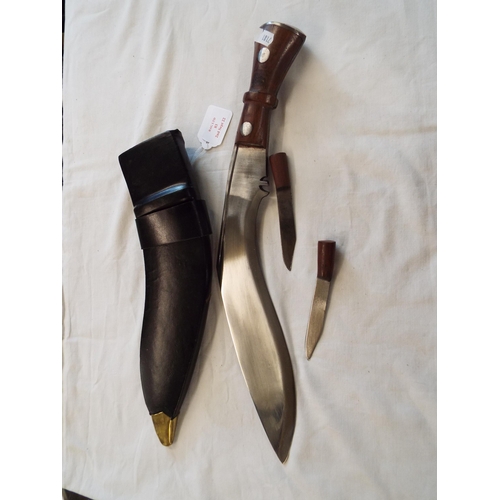 83 - A vintage kukri knife in leather scabbard