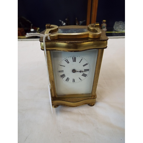 86 - A French brass and glass carriage clock, needs attention