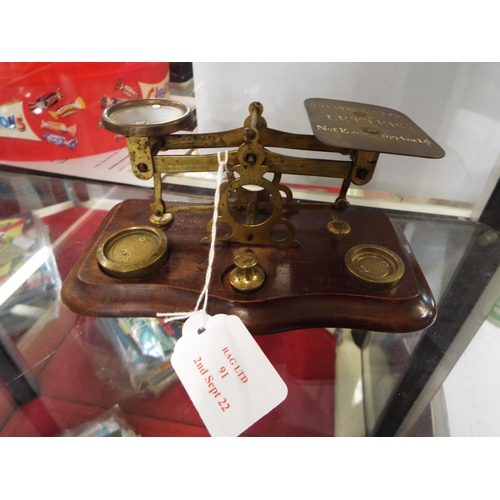 91 - A vintage set of brass postal scales
