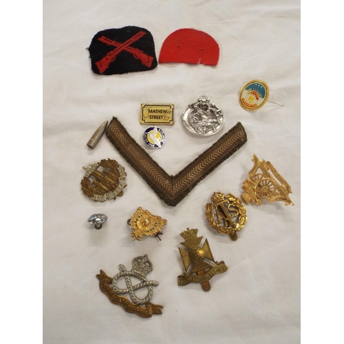 99 - A mixed selection of metal and cloth badges