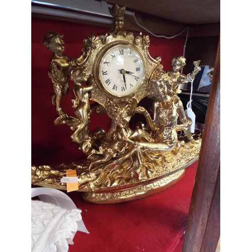 197 - A gilt moulded plastic quartz clock