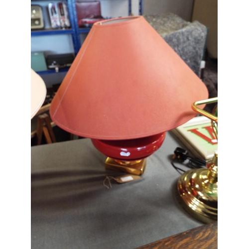 220 - A deep red and gold stylish table lamp