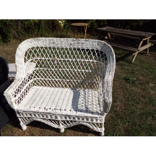 292 - A white wicker garden bench