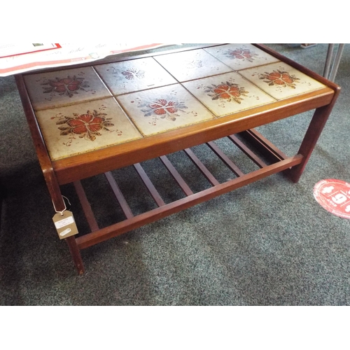 485 - A mid-century teak tiled top table with magazine rack