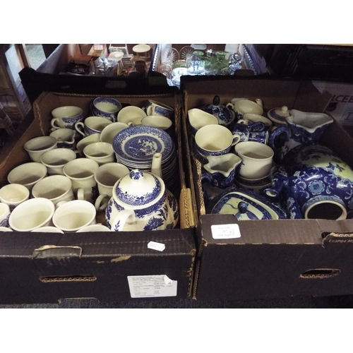 307 - A mixed selection of blue and white china to include cups, saucers, tea-pots, milk jugs, egg cups et... 