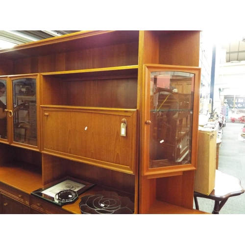 515 - A McIntosh of Kircaldy Fife teak wall unit with two corner ends