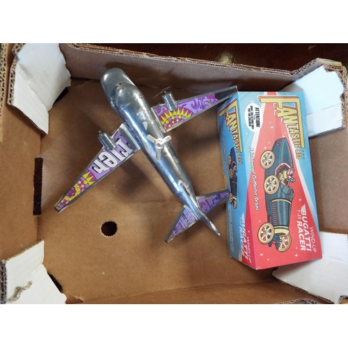 589 - A boxed tin plate model Bugatti clockwork car and a model aeroplane