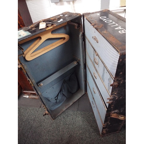 593 - A vintage steamer wardrobe trunk with fitted interior