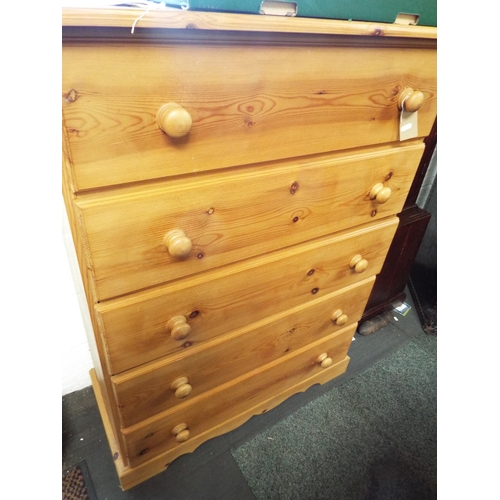 596 - A pine chest of five long drawers