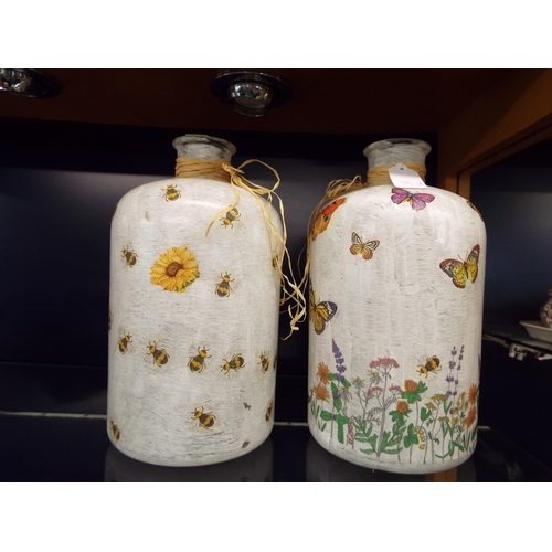 31 - Two hand-painted glass jars with butterfly and bumble bee decoration