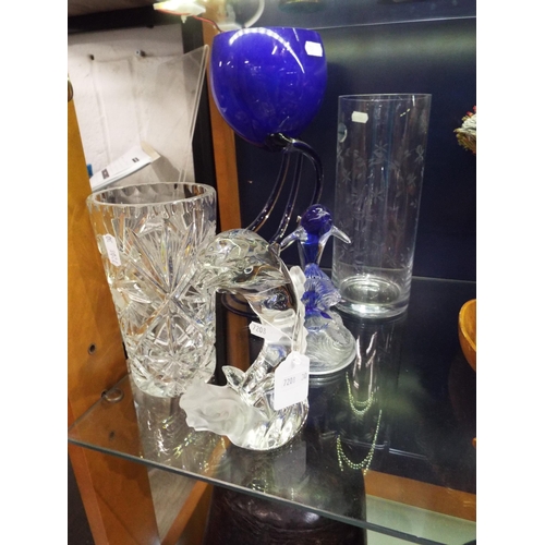 91 - A selection of glass ware to include two leaping dolphins, vases (5)