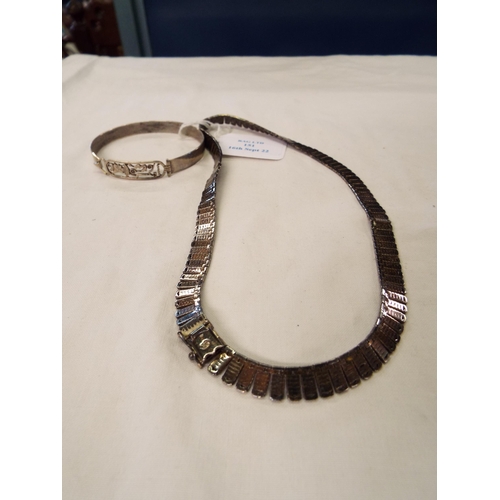 151 - A silver flat linked necklace together with a single bangle