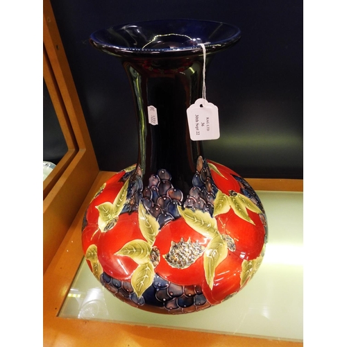 36 - A large Moorcroft style vase with peach and plum decoration signed to the base