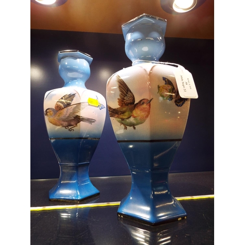 38 - A pair of decorative vases with bird and butterfly decoration