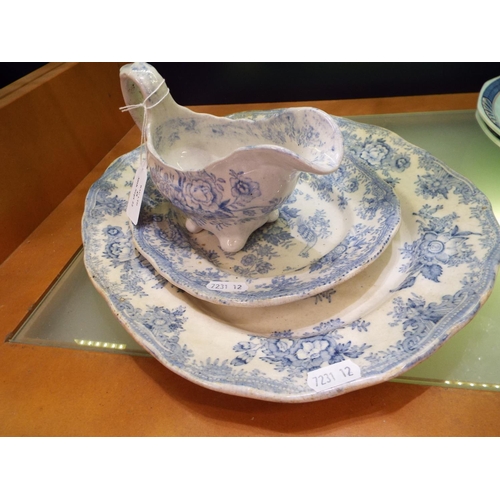 48 - An old blue and white china sauce boat with two old blue and white platters