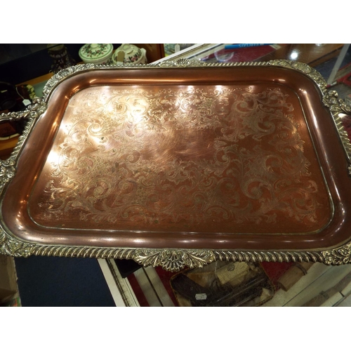 69 - A silver-plated two handled tray with shell and dragooned border