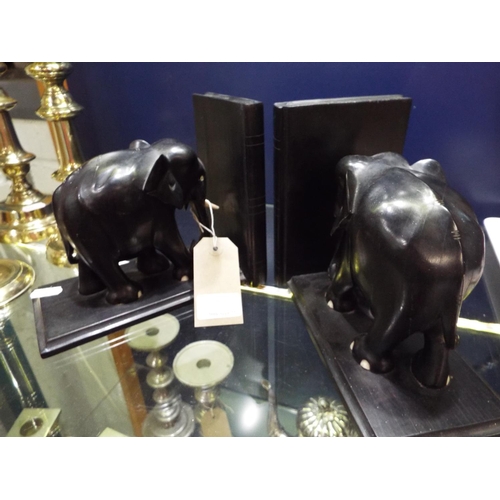 77 - A pair of carved ebony elephant bookends