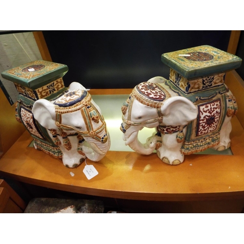 81 - A pair of ceramic elephant plant pot stands