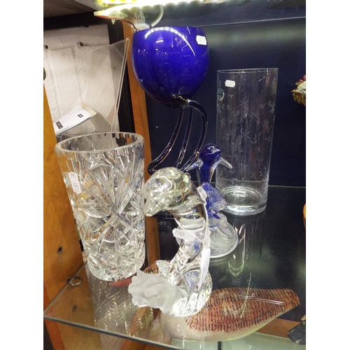 90 - A selection of glass ware to include two leaping dolphins, vases (5)