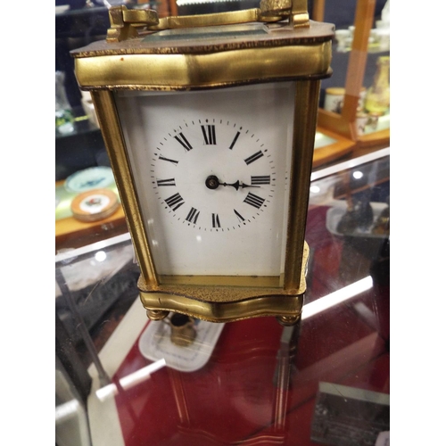 107 - A French brass and glass carriage clock, needs attention