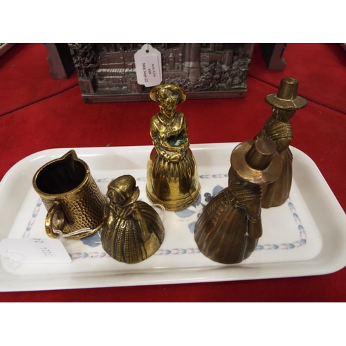 110 - A selection of brass lady bells and jug