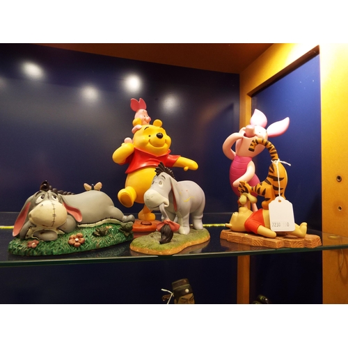 1 - A selection of Disney Winnie the Pooh ceramic figures to include Pooh, Piglet, Tigger, Eeyore (5)