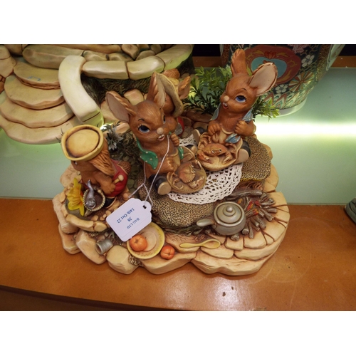 38 - A vintage Pendelfin base with rabbit figures