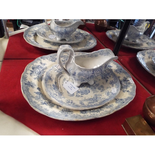 161 - An old blue and white china sauce boat with two old blue and white platters