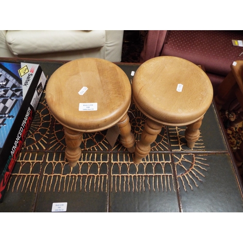 548 - A pair of pine stools