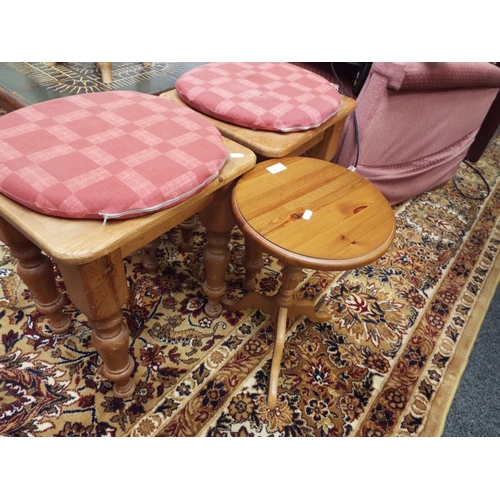 550 - A pair of pine stools and a side table