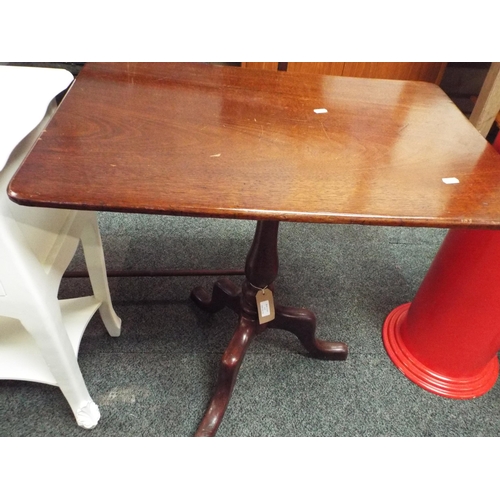 613 - A mahogany oblong snap top side table resting on tri-form base