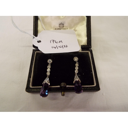 176A - A pair of platinum earrings inset with diamonds and drop amethyst