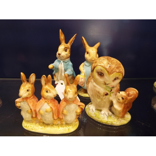 10 - Four Beswick Beatrix Potter figurines to include 'Flopsy Mopsy and Cottontail', 'Peter Rabbit', 'Old... 