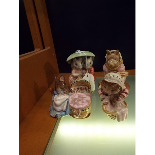 23 - Four Beswick Beatrix Potter figurines to include 'Hunca Munca', 'This Pig Had a Bit of Meat', 'Goody... 